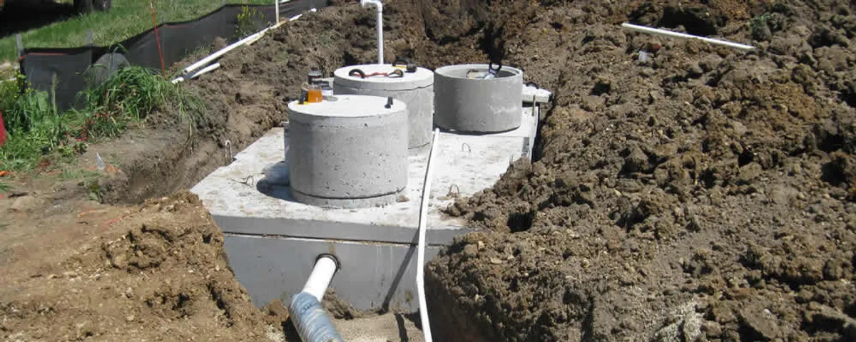 Septic system repair and installation site with tank access ports in Kenosha, WI